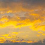 Dramatic golden clouds fine art photography by Layne Morgan