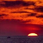 dramatic red sunset over ocean horizon fine art landscape photography