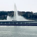 Layne Morgan fine art photography – fountain water spray and reflections on a lake surface