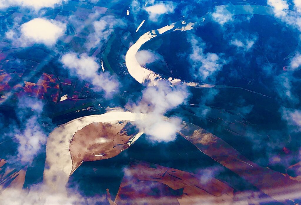 Abstract fluid motion with blue and white cloud-like patterns, contemporary digital art by Layne Morgan