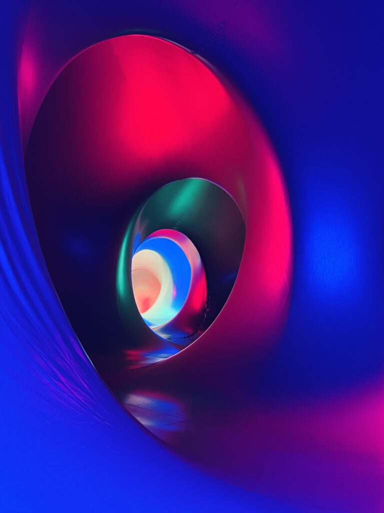 Neon glowing abstract orb with vibrant pink and blue tones, futuristic digital art by Layne Morgan