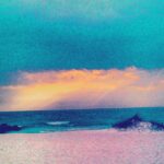 Turquoise sky with soft pastel clouds over the horizon – fine art sky photography by Layne Morgan