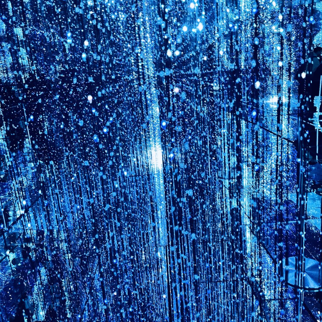 Abstract blue light particles with vertical rain-like motion, contemporary digital art by Layne Morgan
