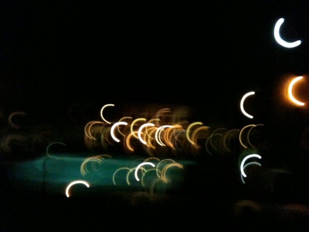 Abstract light painting fine art photography with glowing light trails in dark background by Layne Morgan