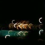 Abstract light painting fine art photography with glowing light trails in dark background by Layne Morgan