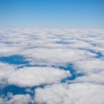 Aerial view of soft white cloud layers stretching across the sky