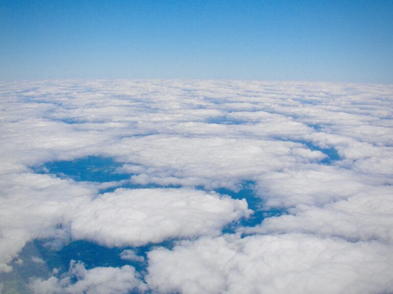 Aerial view of soft white cloud layers stretching across the sky