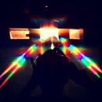 Abstract rainbow prism light beams in darkness – experimental light photography by Layne Morgan