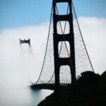 Golden Gate Bridge rising through coastal fog fine art architectural photography by Layne Morgan