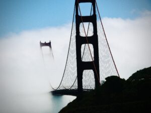 Golden Gate Bridge rising through coastal fog fine art architectural photography by Layne Morgan