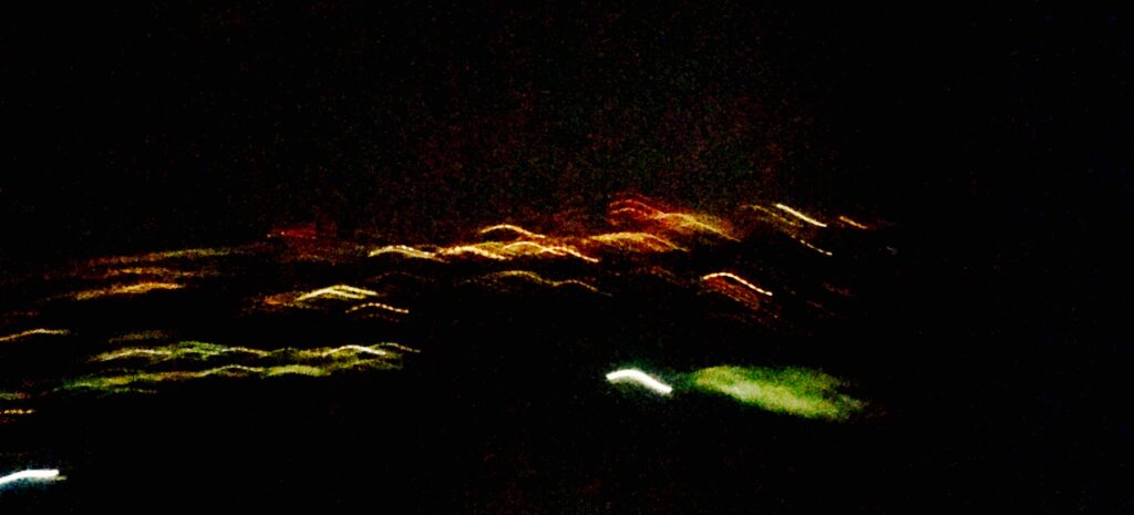 Abstract green and yellow light trails captured with long exposure – experimental photography by Layne Morgan