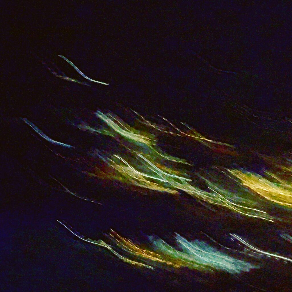 Abstract green and yellow light streaks captured with long exposure – Painting With Light photography by Layne Morgan