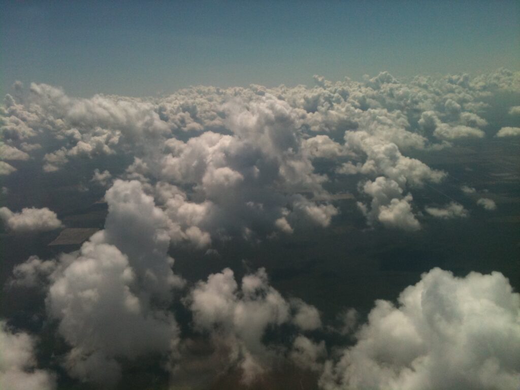 Aerial view of dense clouds from above – fine art cloudscape photography by Layne Morgan