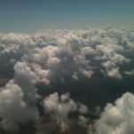 Aerial view of dense clouds from above – fine art cloudscape photography by Layne Morgan