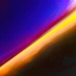 Abstract color field photograph with diagonal band of warm yellow and orange light against deep blue and purple tones by Layne Morgan