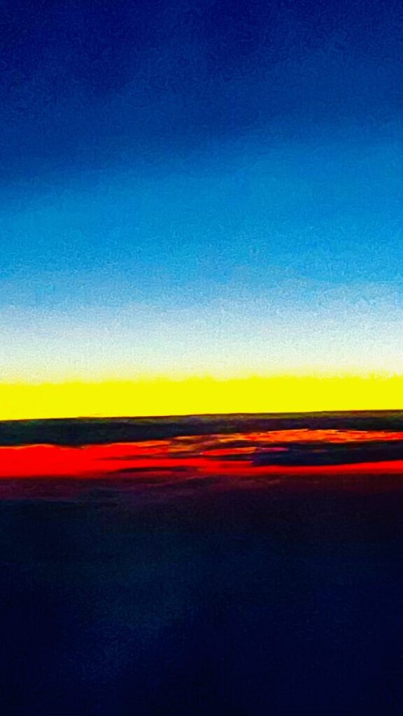 Abstract color field horizon with blue sky and red yellow bands – fine art photography by Layne Morgan