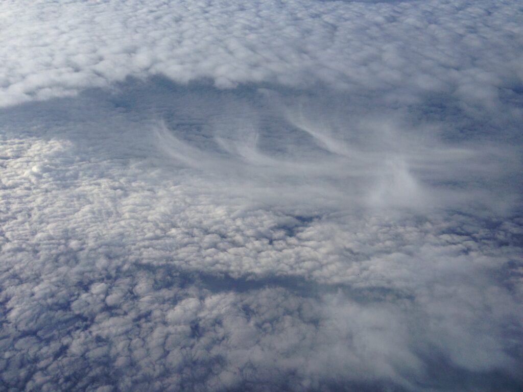 Soft layered clouds seen from above – abstract cloudscape fine art photography by Layne Morgan