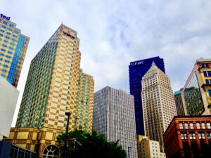 Modern glass skyscrapers rising against blue sky urban architecture fine art photography by Layne Morgan