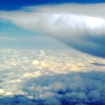 Aerial cloud formation above landscape – fine art sky photography by Layne Morgan