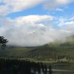 Mountain lake landscape with clouds and forest fine art photography by Layne Morgan