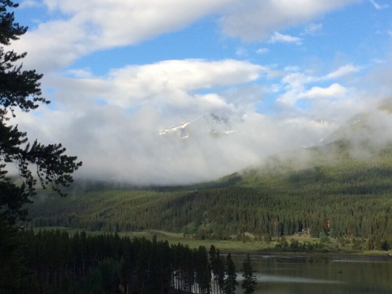 Mountain lake landscape with clouds and forest fine art photography by Layne Morgan
