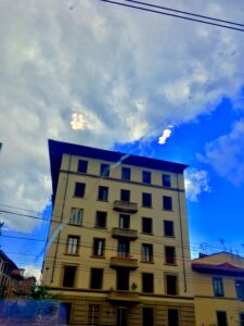 Historic city building against dramatic clouds urban architecture fine art photography by Layne Morgan