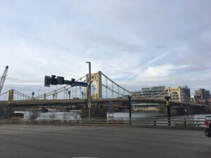 Industrial bridge and port structure over water urban infrastructure fine art photography by Layne Morgan