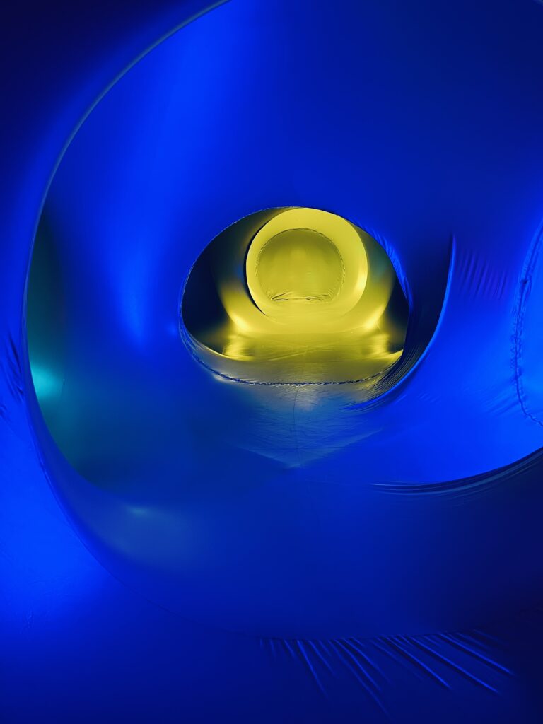 Abstract deep blue light with glowing yellow center and soft circular gradients