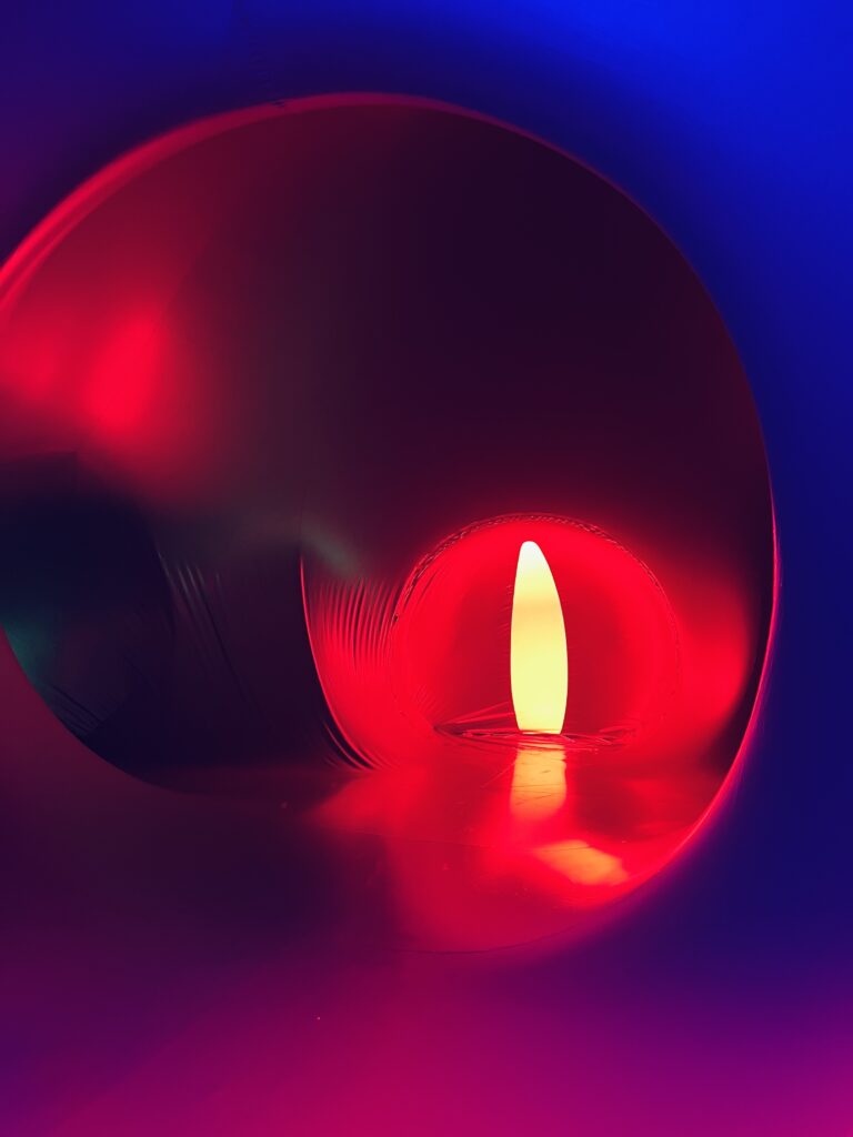 Abstract red glowing light with circular reflections and deep gradient tones
